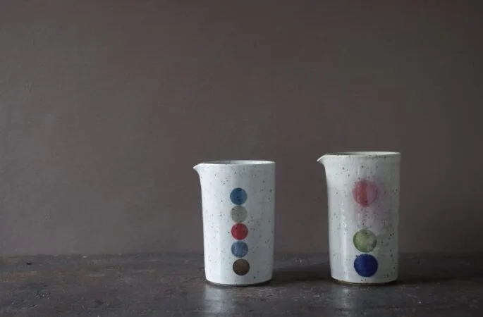 reduction fired, thrown stoneware small pourers with circle decoration by award winning potters James and Tilla Waters in Carmarthenshire, Wales, UK