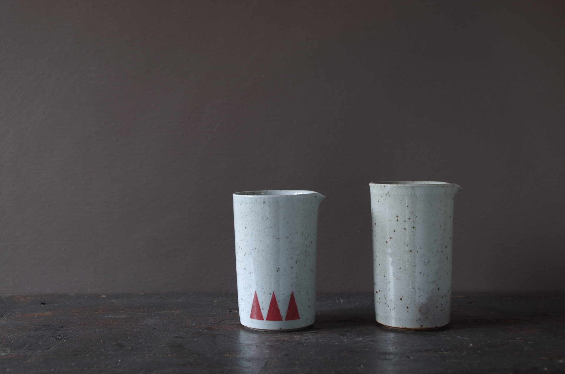 reduction fired, thrown stoneware small pourers with circle decoration by award winning potters James and Tilla Waters in Carmarthenshire, Wales, UK