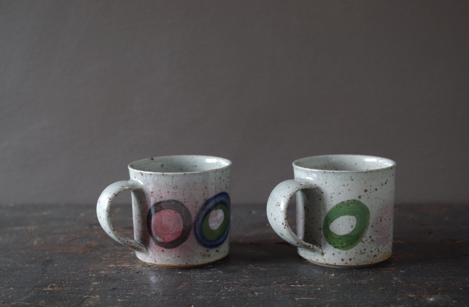 Reduction fired, wheel thrown, stoneware coffee can with pulled handle and hand decorated by award winning studio potters James and Tilla Waters in Carmarthenshire, Wales, UK