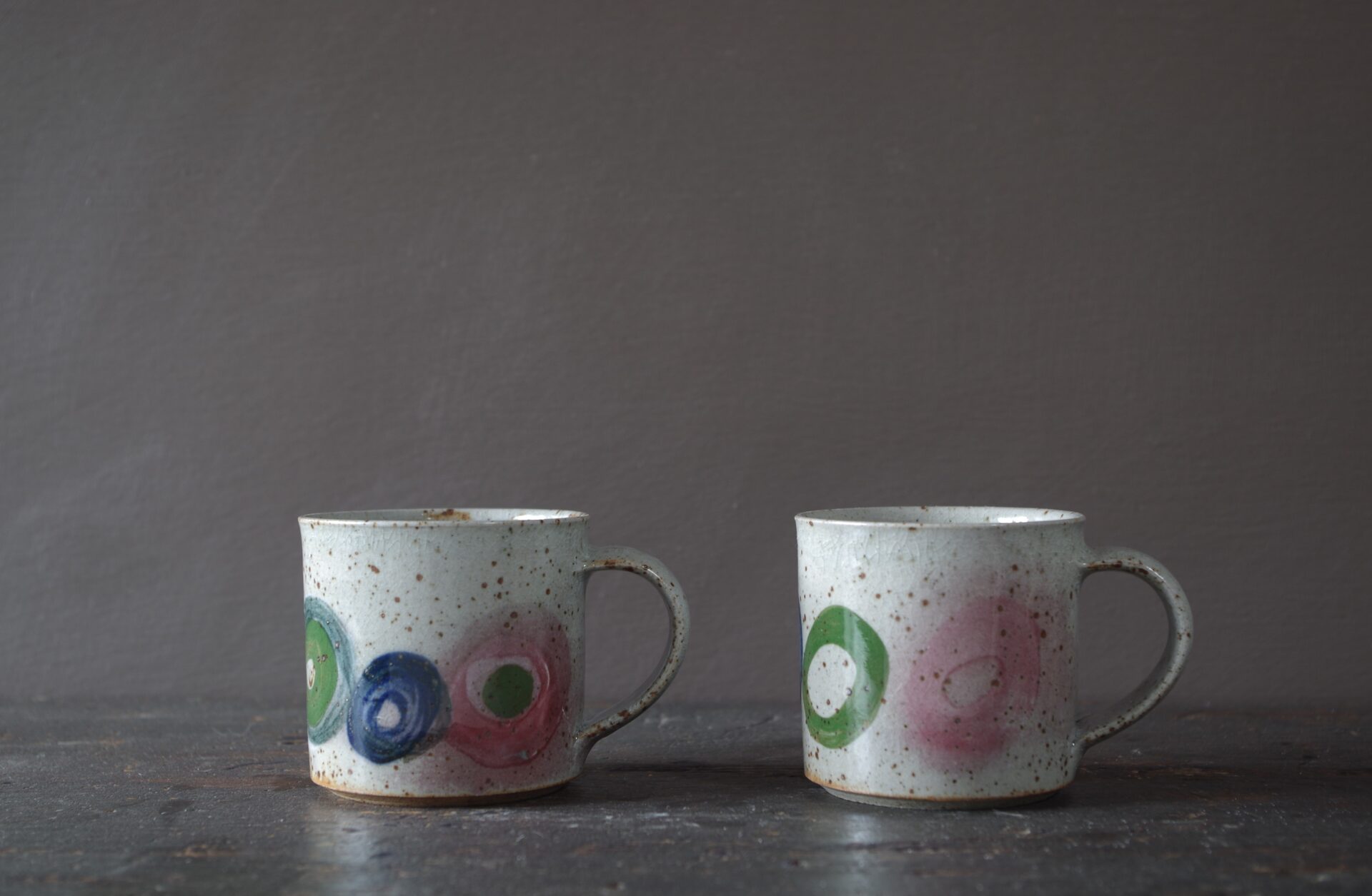Reduction fired, wheel thrown, stoneware coffee can with pulled handle and hand decorated by award winning studio potters James and Tilla Waters in Carmarthenshire, Wales, UK