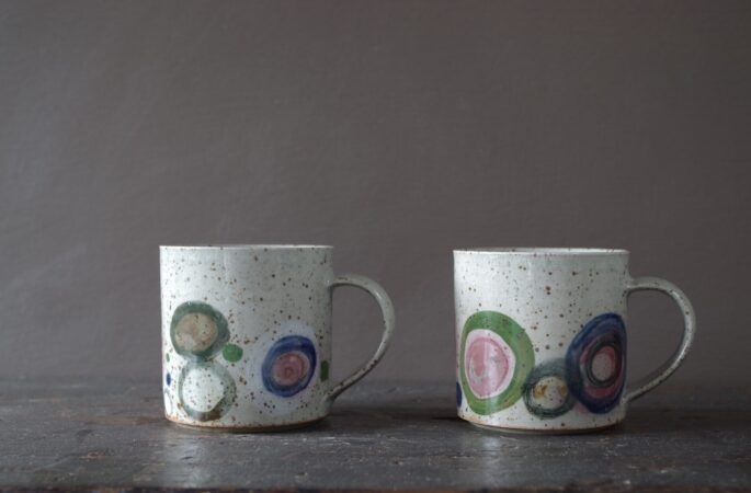 Reduction fired, wheel thrown, stoneware mug with pulled handle and hand decorated by award winning studio potters James and Tilla Waters in Carmarthenshire, Wales, UK