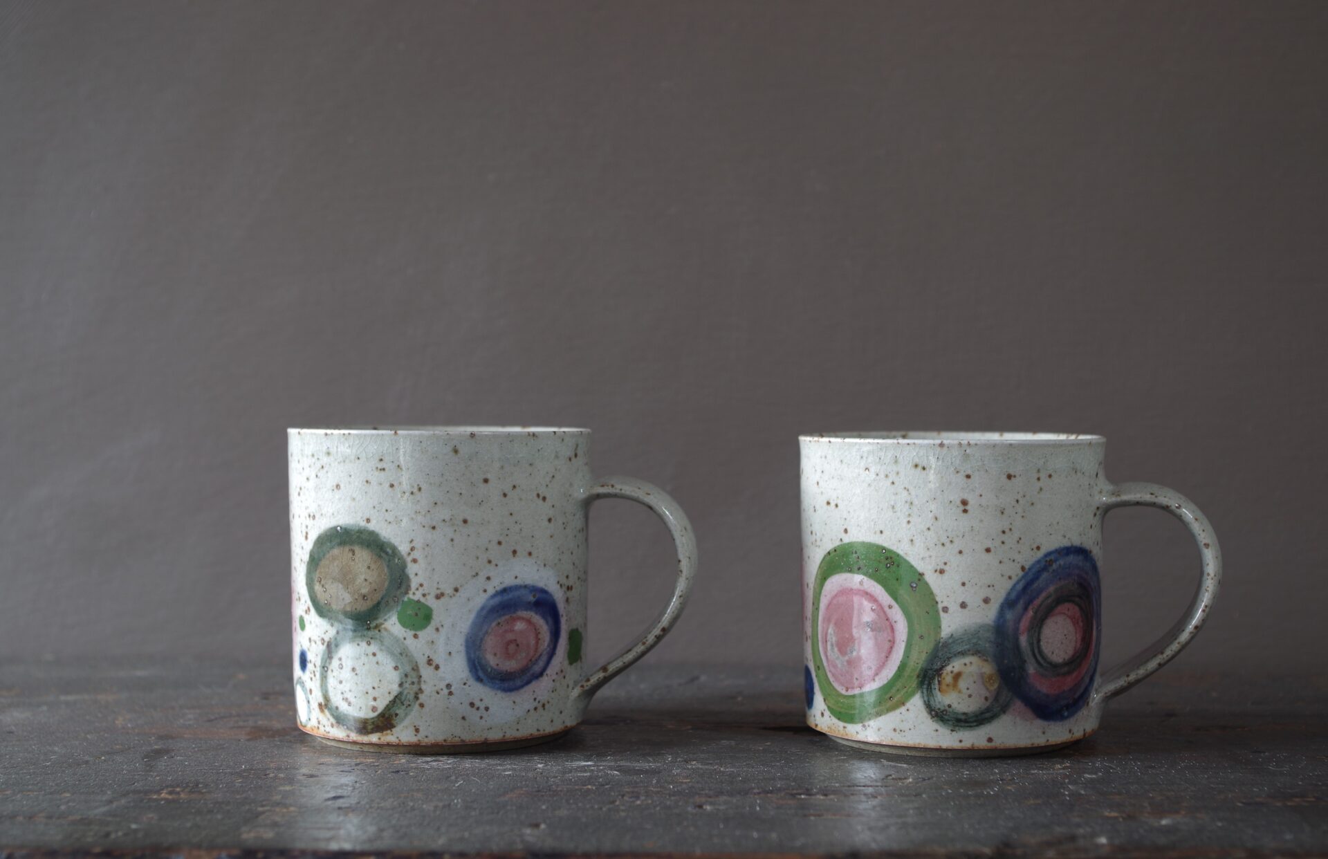 Reduction fired, wheel thrown, stoneware mug with pulled handle and hand decorated by award winning studio potters James and Tilla Waters in Carmarthenshire, Wales, UK