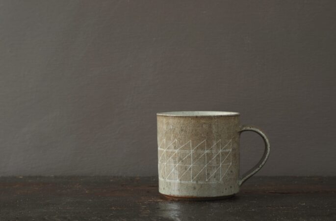 reduction fired stoneware mug (8cm x 8cm) with inlaid geometric decoration and pulled handle by award winning potters James and Tilla Waters in Carmartheshire, Wales, UK