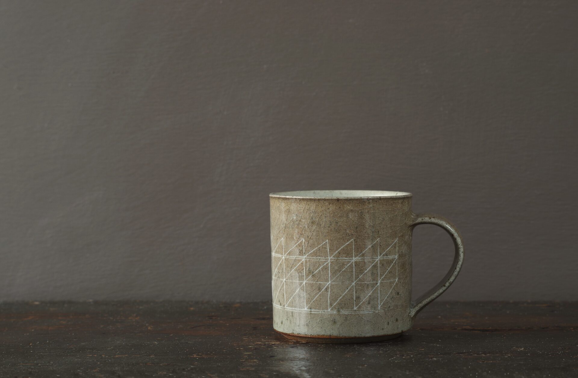 reduction fired stoneware mug (8cm x 8cm) with inlaid geometric decoration and pulled handle by award winning potters James and Tilla Waters in Carmartheshire, Wales, UK