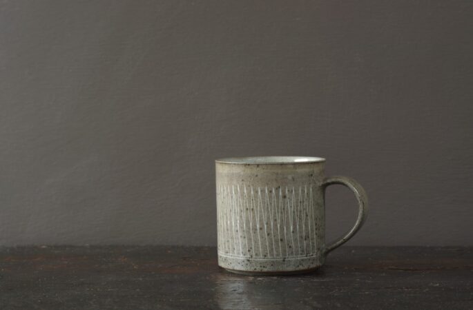 reduction fired stoneware mug (8cm x 8cm) with inlaid geometric decoration and pulled handle by award winning potters James and Tilla Waters in Carmartheshire, Wales, UK