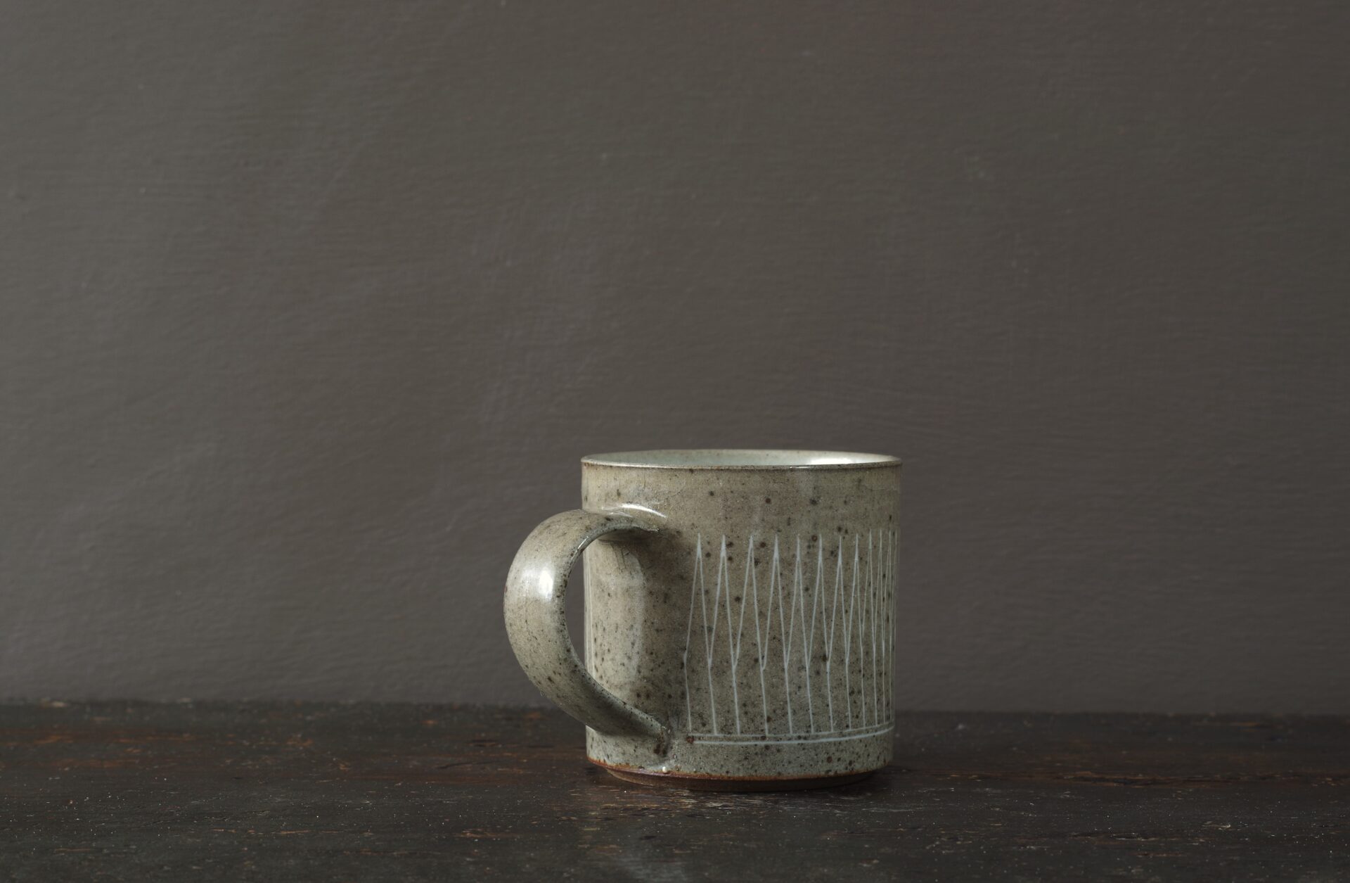 reduction fired stoneware mug (8cm x 8cm) with inlaid geometric decoration and pulled handle by award winning potters James and Tilla Waters in Carmartheshire, Wales, UK