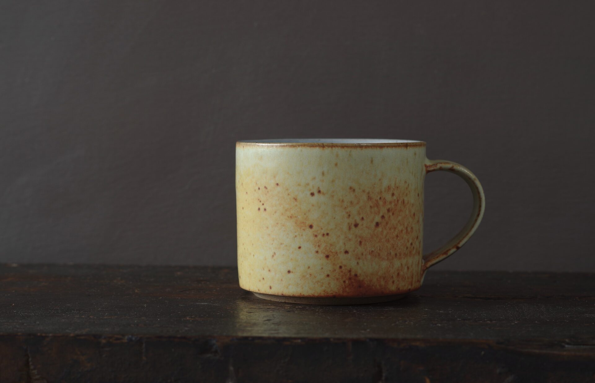 Wheel thrown reduction fired stoneware large breakfast mug with soft yellow glaze by award winning potters James and Tilla Waters in Carmarthenshire, Wales, UK
