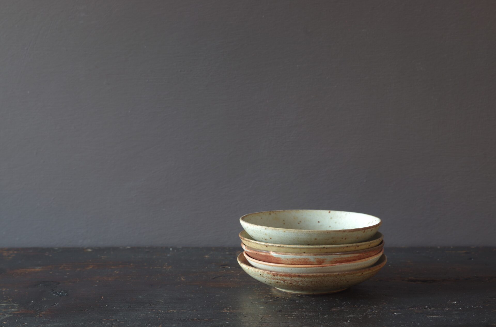 reduction fired, thrown stoneware open mini bowl with soft yellow glaze by award winning potters James and Tilla Waters in Carmarthenshire, Wales, UK