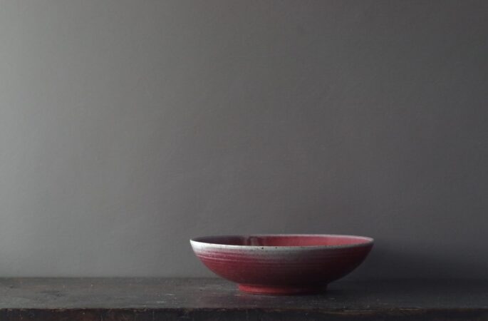 reduction fired, thrown stoneware ramen bowl with copper red glaze by award winning potters James and Tilla Waters in Carmarthenshire, Wales, UK