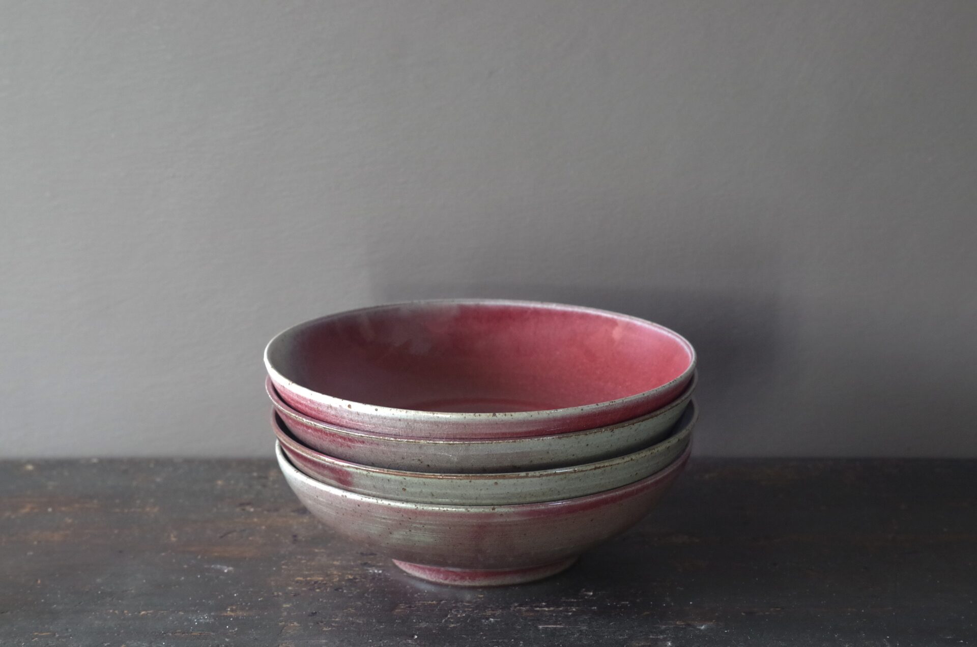 reduction fired, thrown stoneware ramen bowl with copper red glaze by award winning potters James and Tilla Waters in Carmarthenshire, Wales, UK