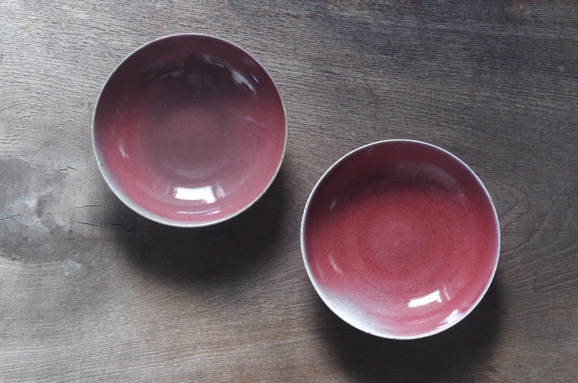 reduction fired, thrown stoneware ramen bowl with copper red glaze by award winning potters James and Tilla Waters in Carmarthenshire, Wales, UK