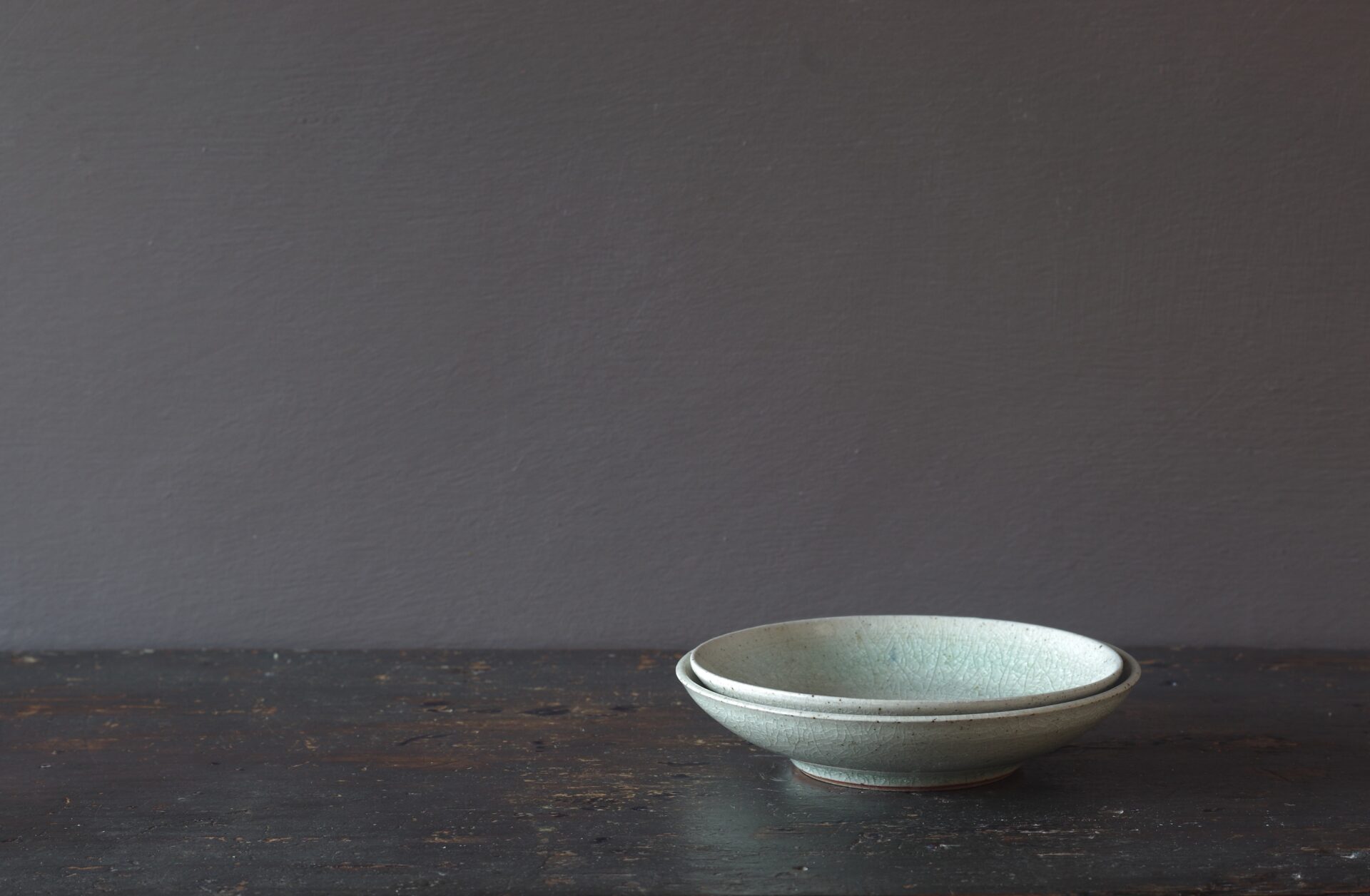 reduction fired, thrown stoneware open mini bowl with pale green crackle glaze by award winning potters James and Tilla Waters in Carmarthenshire, Wales, UK