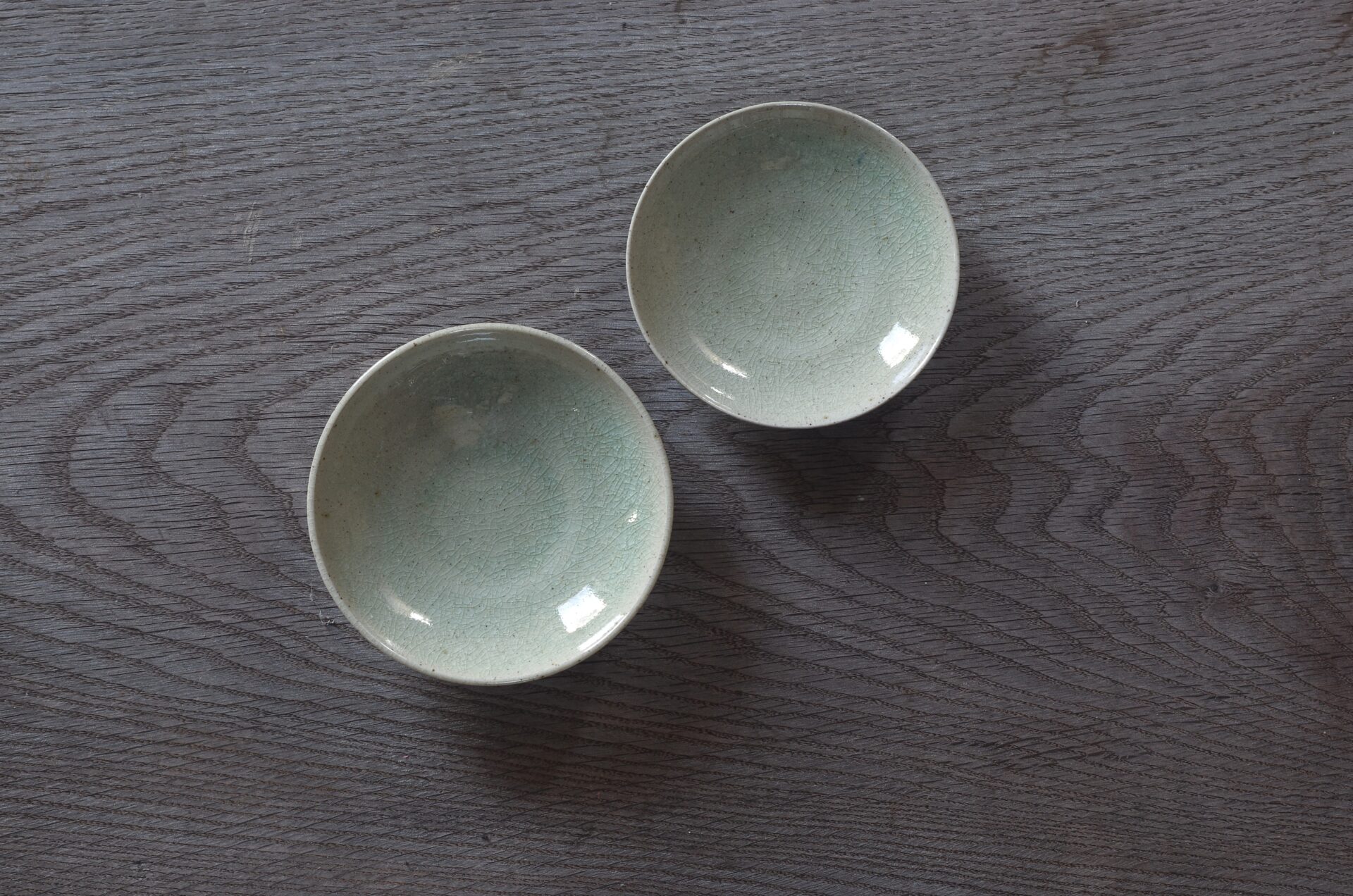 reduction fired, thrown stoneware open mini bowl with pale green crackle glaze by award winning potters James and Tilla Waters in Carmarthenshire, Wales, UK